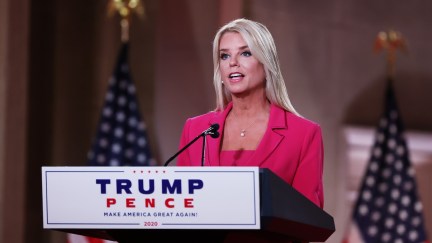 pam bondi standing at a podium
