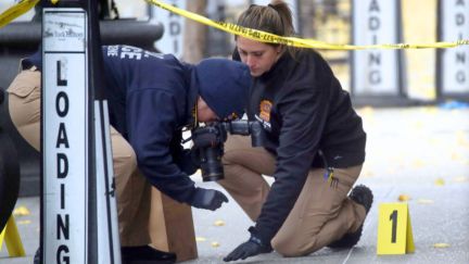 NEW YORK, NEW YORK - DECEMBER 04: Police place bullet casing markers outside of a Hilton Hotel in Midtown Manhattan where United Healthcare CEO Brian Thompson was fatally shot on December 04, 2024 in New York City. Brian Thompson was shot and killed before 7:00 AM this morning outside the Hilton Hotel, just before he was set to attend the company's annual investors' meeting. (Photo by Spencer Platt/Getty Images)