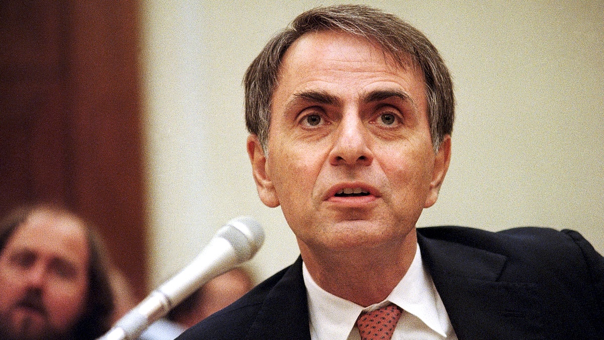 Dr. Carl Sagan is shown testifying at a House hearing on the future of space.