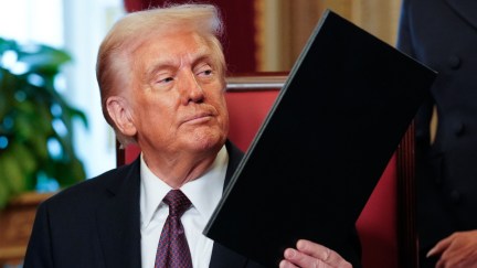 Donald Trump holds an Executive Order in the President's Room