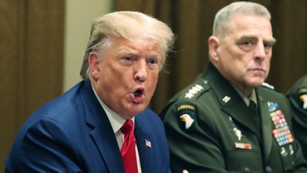 Donald Trump speaks at a military briefing as Joint Chiefs of Staff Chairman Mark Milley looks on