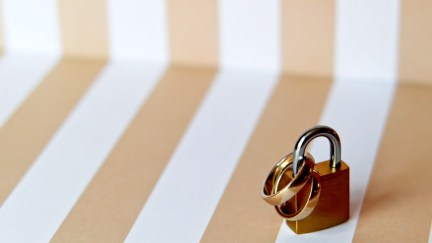 Wedding rings padlocked together