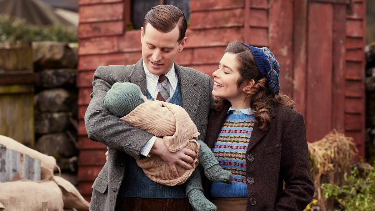 Nicholas Ralph and Rachel Shenton with a baby in All Creatures Great and Small