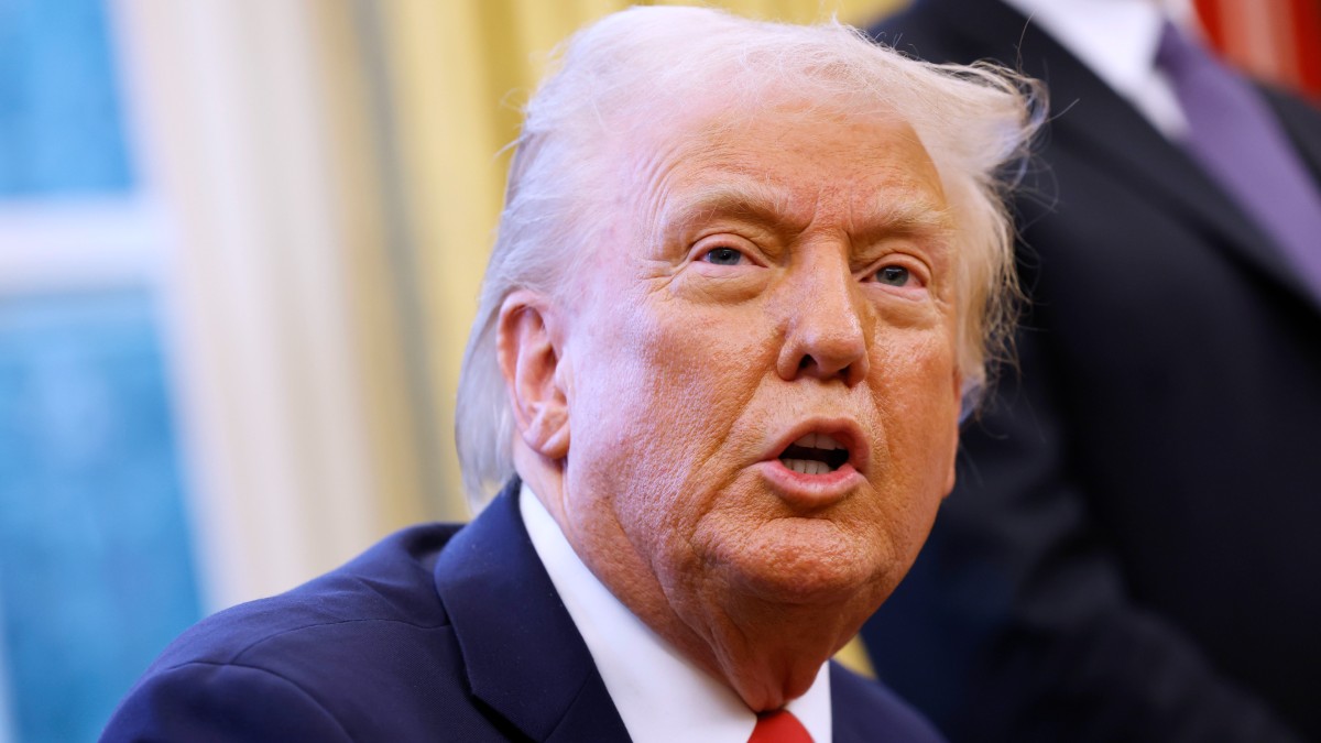 Donald Trump talks to reporters in the Oval Office