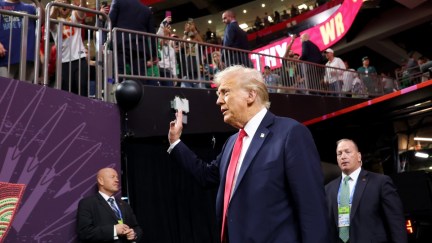 Donald Trump walks onto the field at the Super Bowl