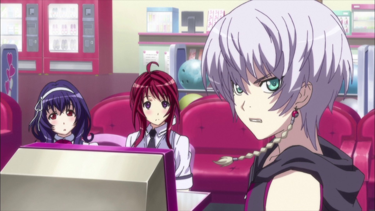 Two young girls sit behind a desk while a lilac-haired woman looks angrily away from them in 'The Qwaser of Stigmata'