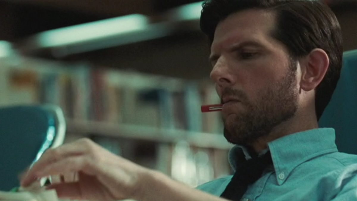 mark scout sitting with a pen in his mouth