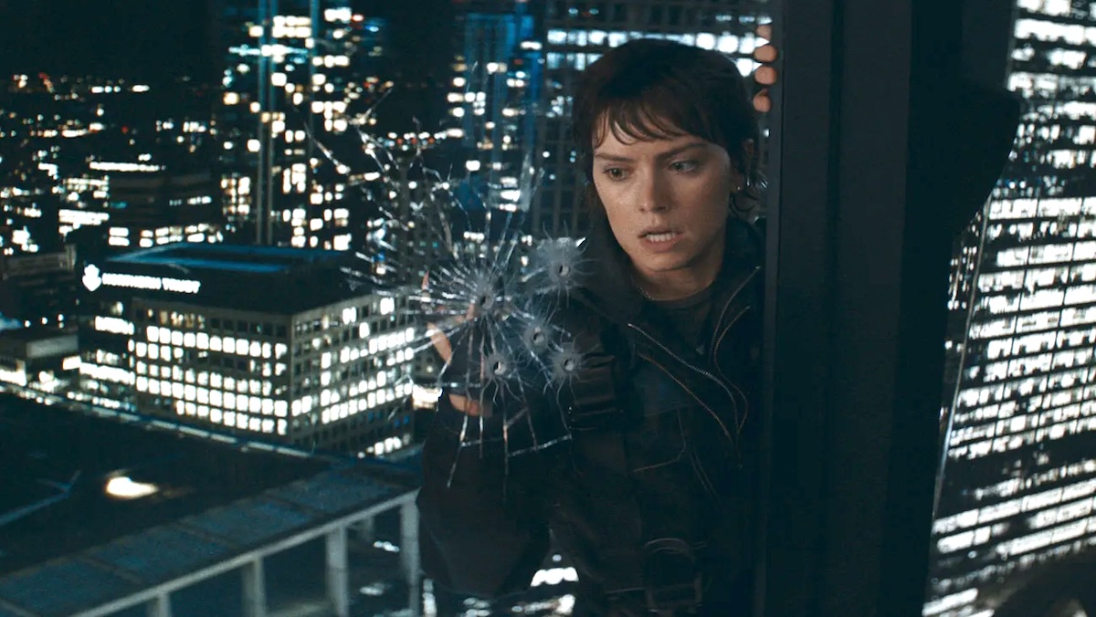 Daisy Ridley on the outside of a window