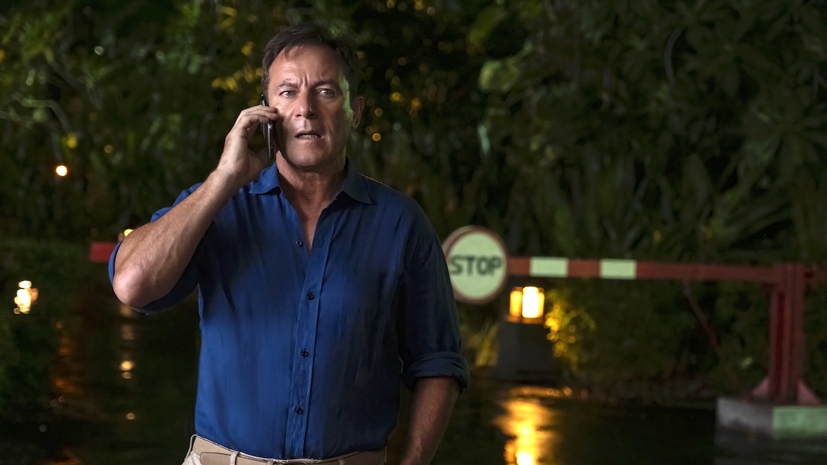jason isaacs on the phone in white lotus
