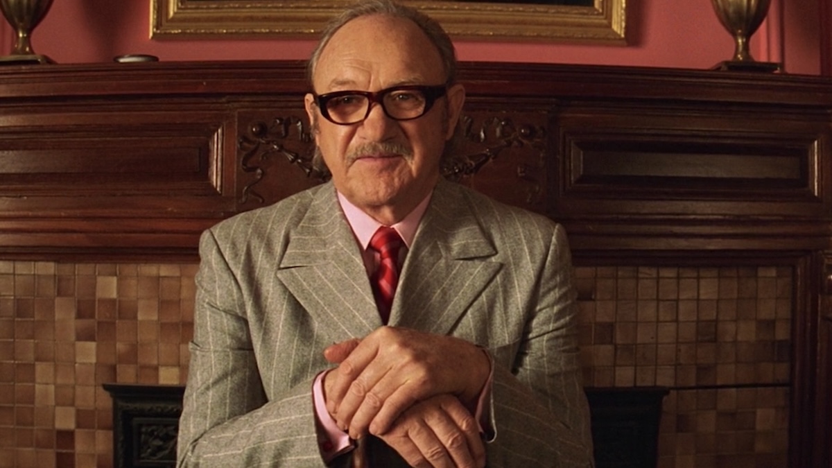 Gene Hackman sitting down in the Royal Tenenbaums