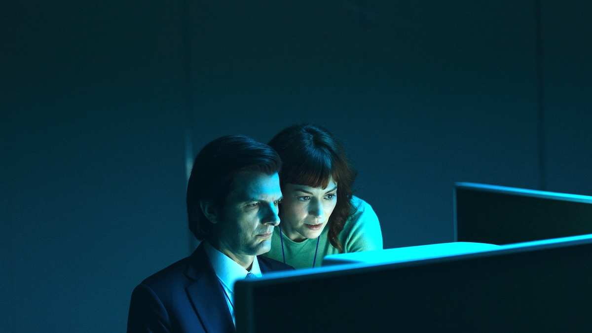 mark and helly sitting at a computer on the severed floor