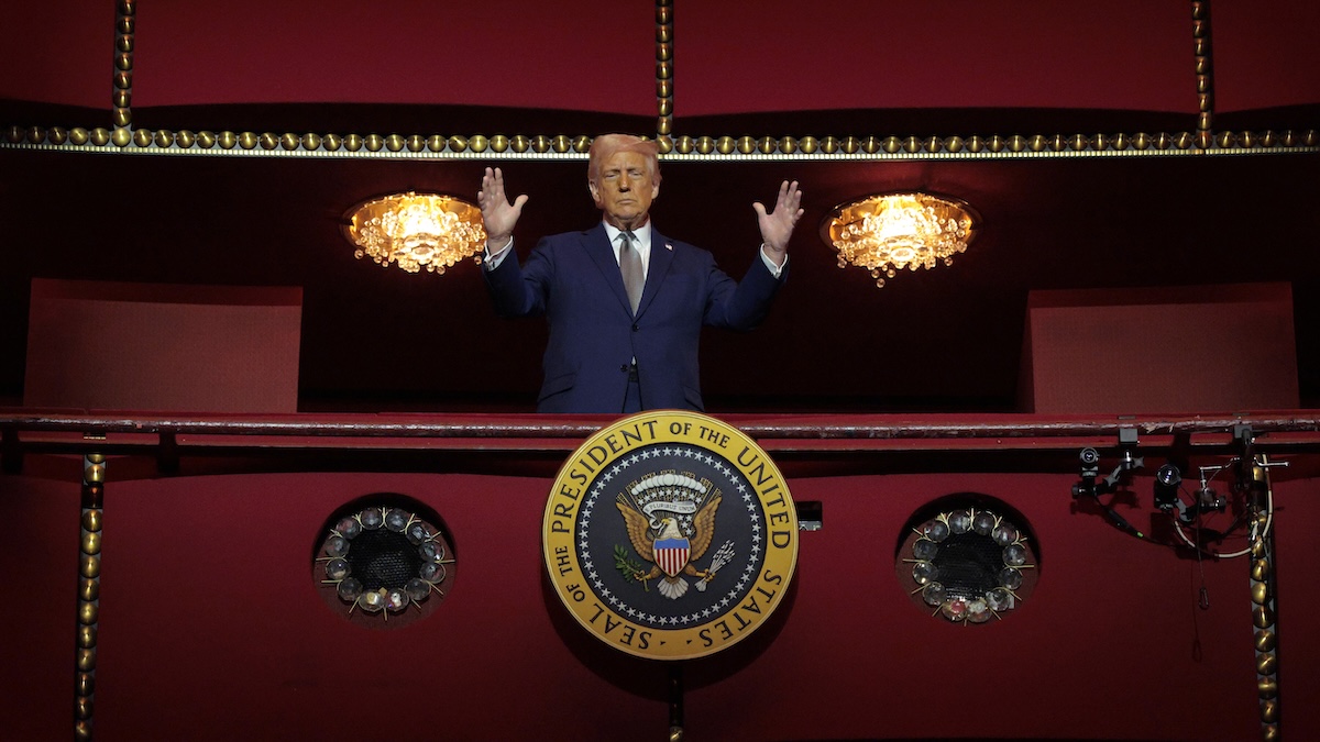 Donald Trump looming in a balcony