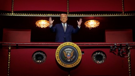 Donald Trump looming in a balcony