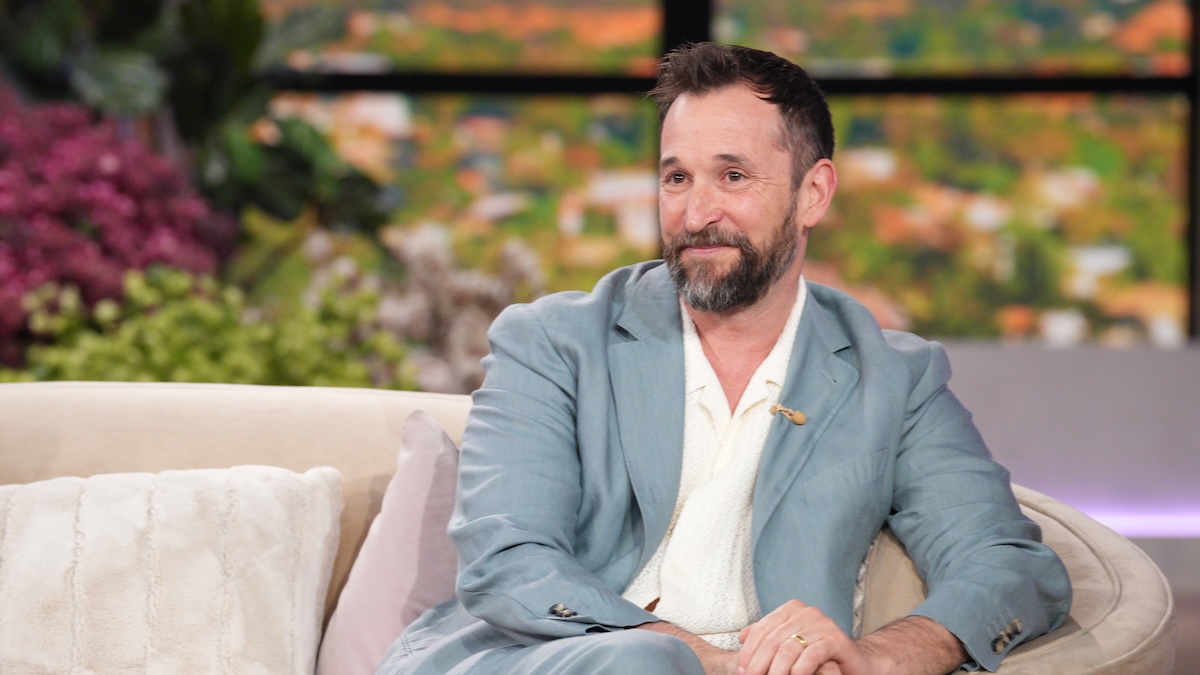 noah wyle on a couch