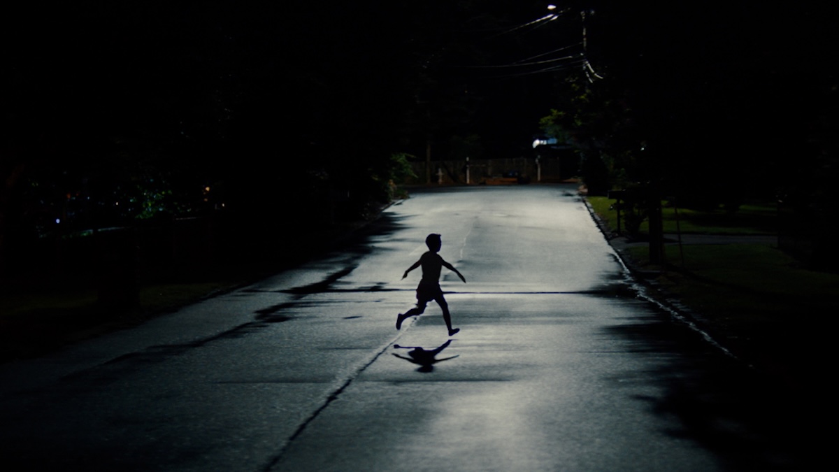 a kid running in the street