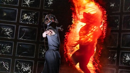 henry creel standing by a demogorgon