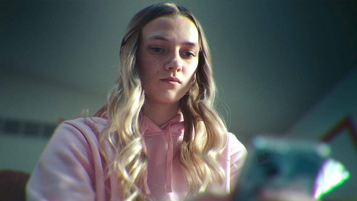 a girl looking at her phone