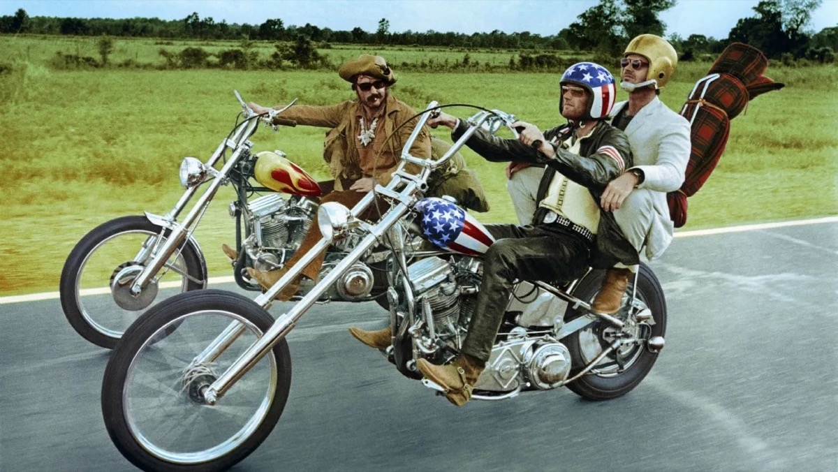 Three men ride motorcycles in "Easy Rider" 