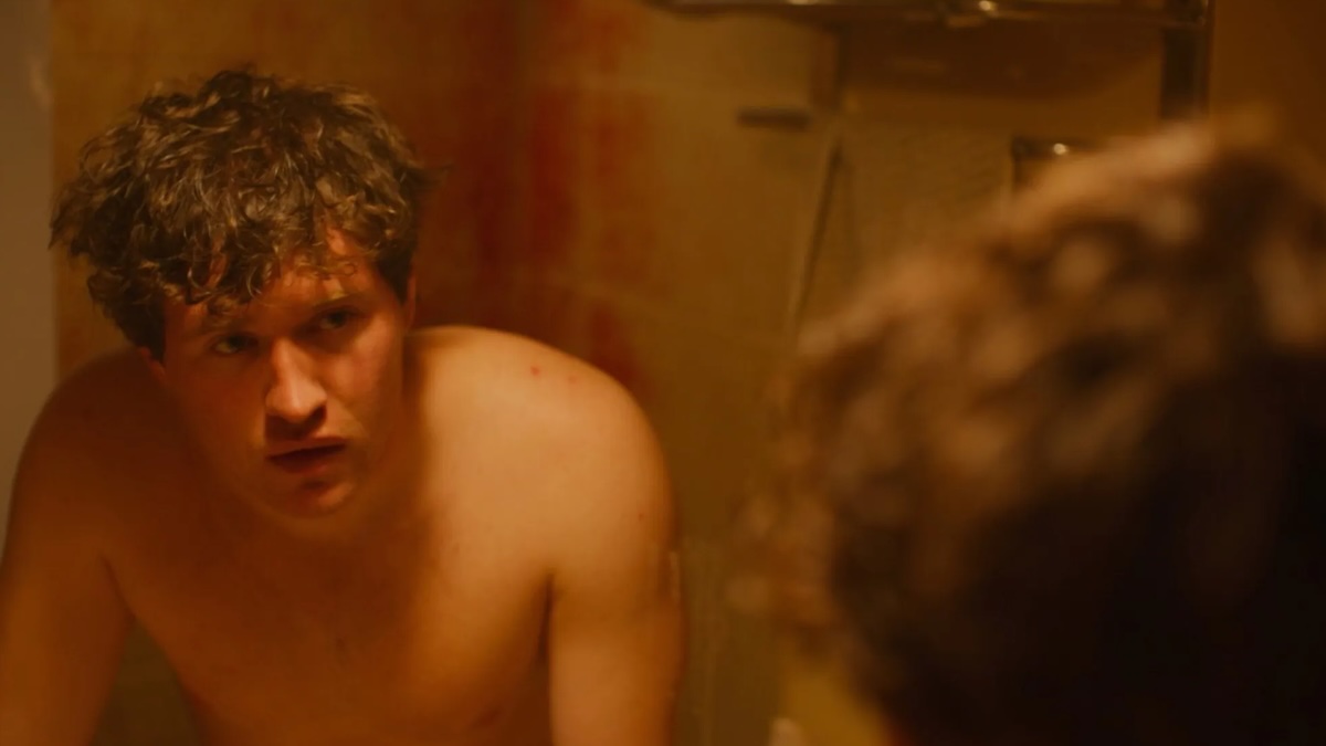 man looking in a mirror