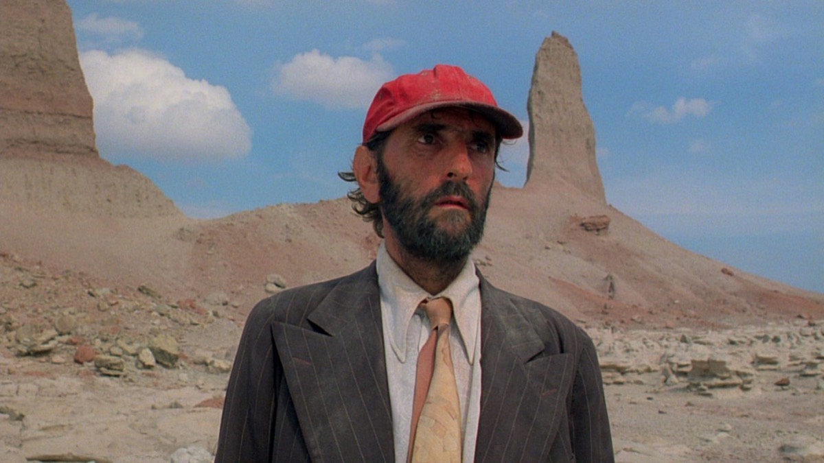 A man stands lonely in the desert wasteland in "Paris, Texas"
