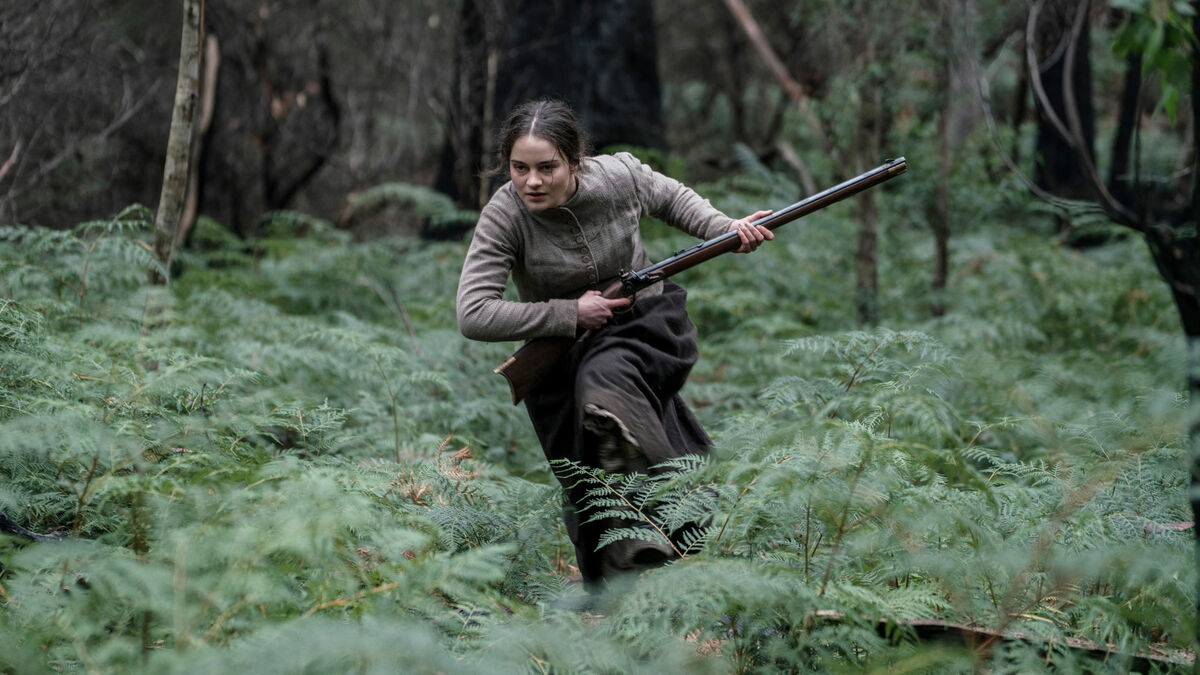 A woman runs through the woods in "The Nightingale"  