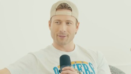 glen powell with a microphone