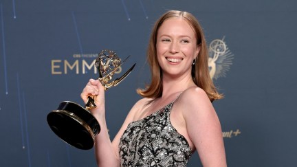 Hannah Einbinder holding an Emmy