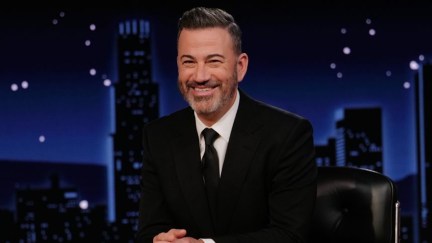 jimmy kimmel sitting at a table