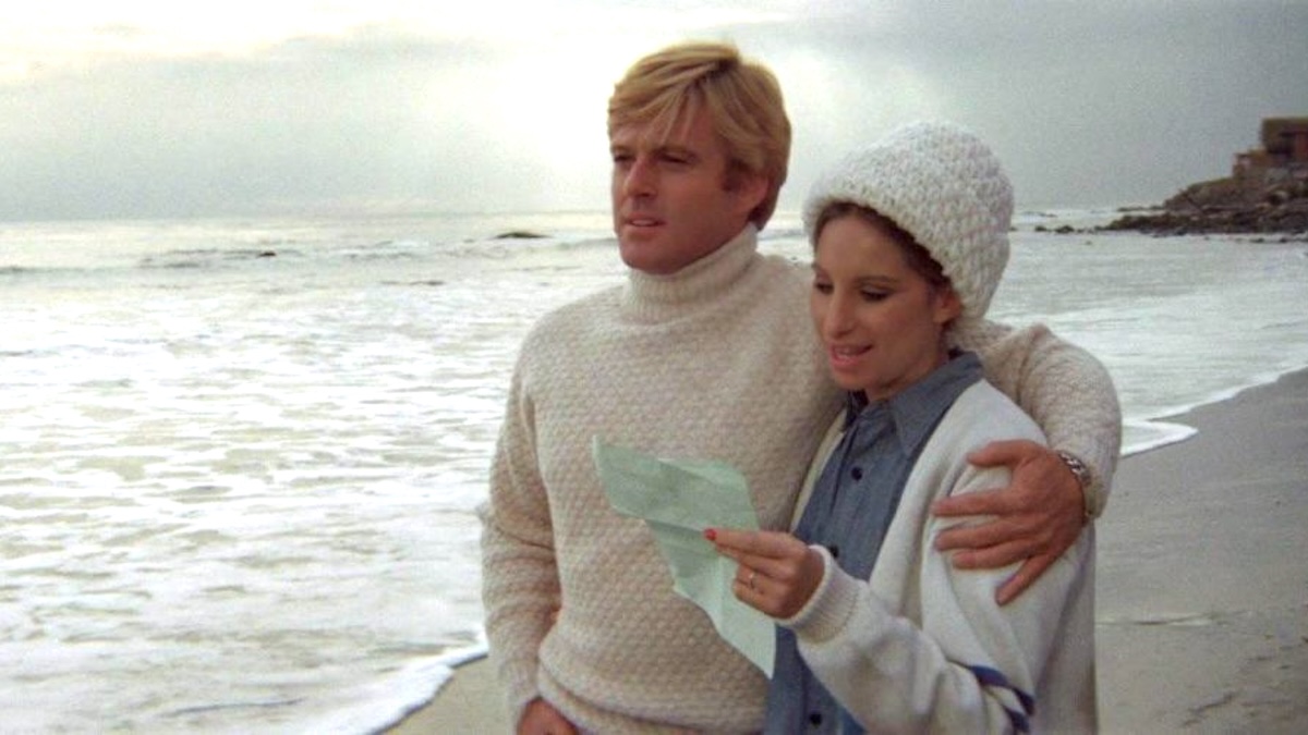 robert redford in a sweater on the beach