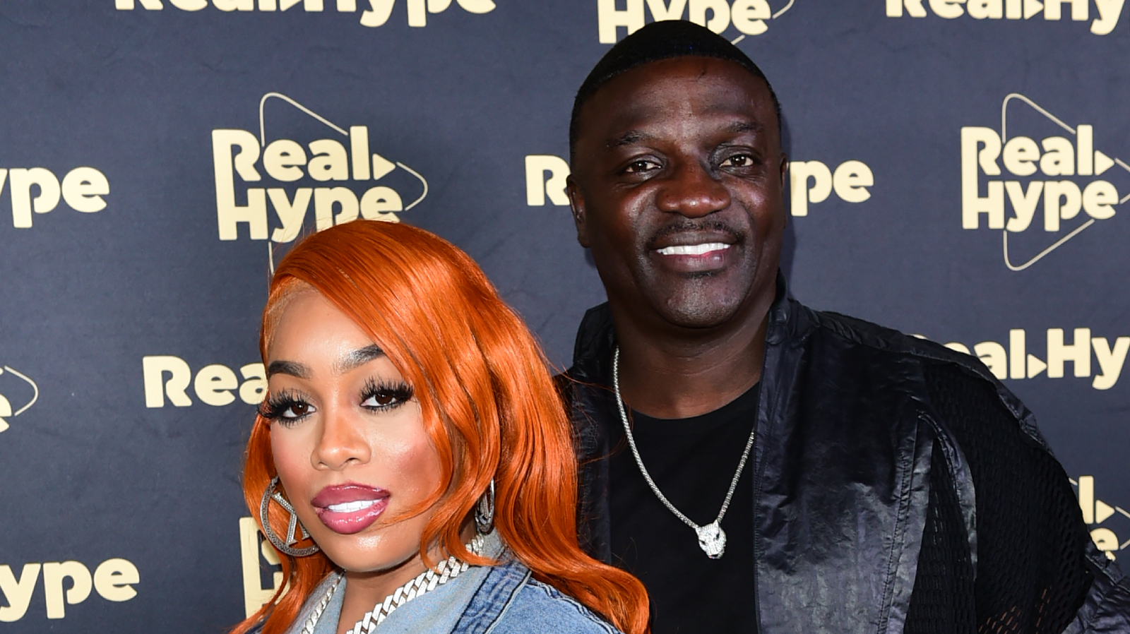 Tomeka Thaim and Akon at an event. (Photo by Vivien Killilea/Getty Images for Real Hype Creative)