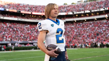 glen powell in football stadium