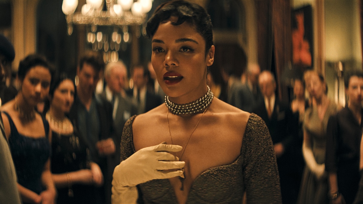 tessa thompson standing in a dress