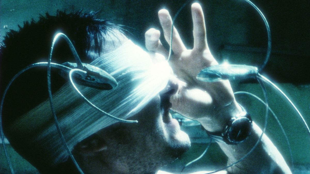 A man with a bandage over his eyes touches his face in "Minority Report"