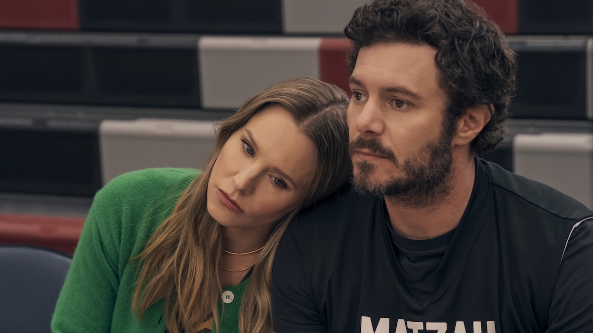 woman with head on man's shoulder