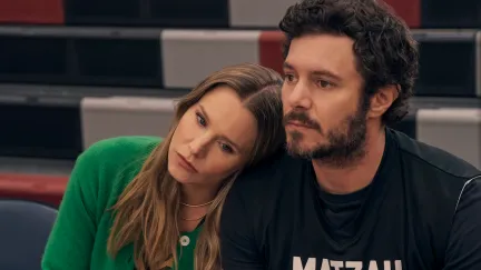 woman with head on man's shoulder