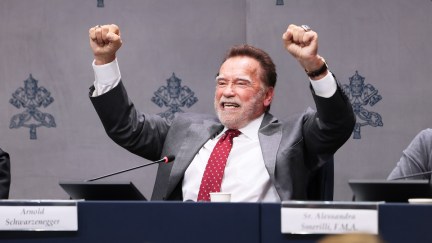 arnold with his hands in the air