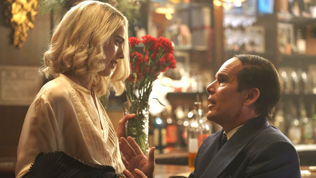 a woman looking down at a man