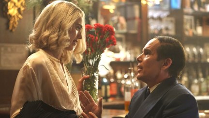 a woman looking down at a man