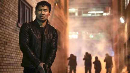 simu liu standing in the street