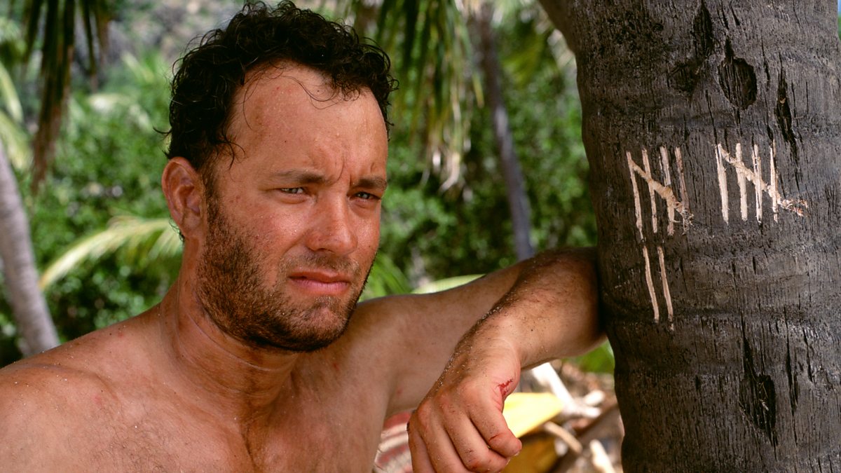 A disheveled man leans up against a scored tree in "Cast Away"