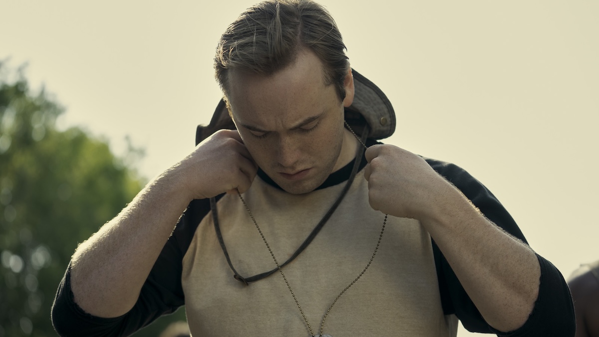 man standing with a hat
