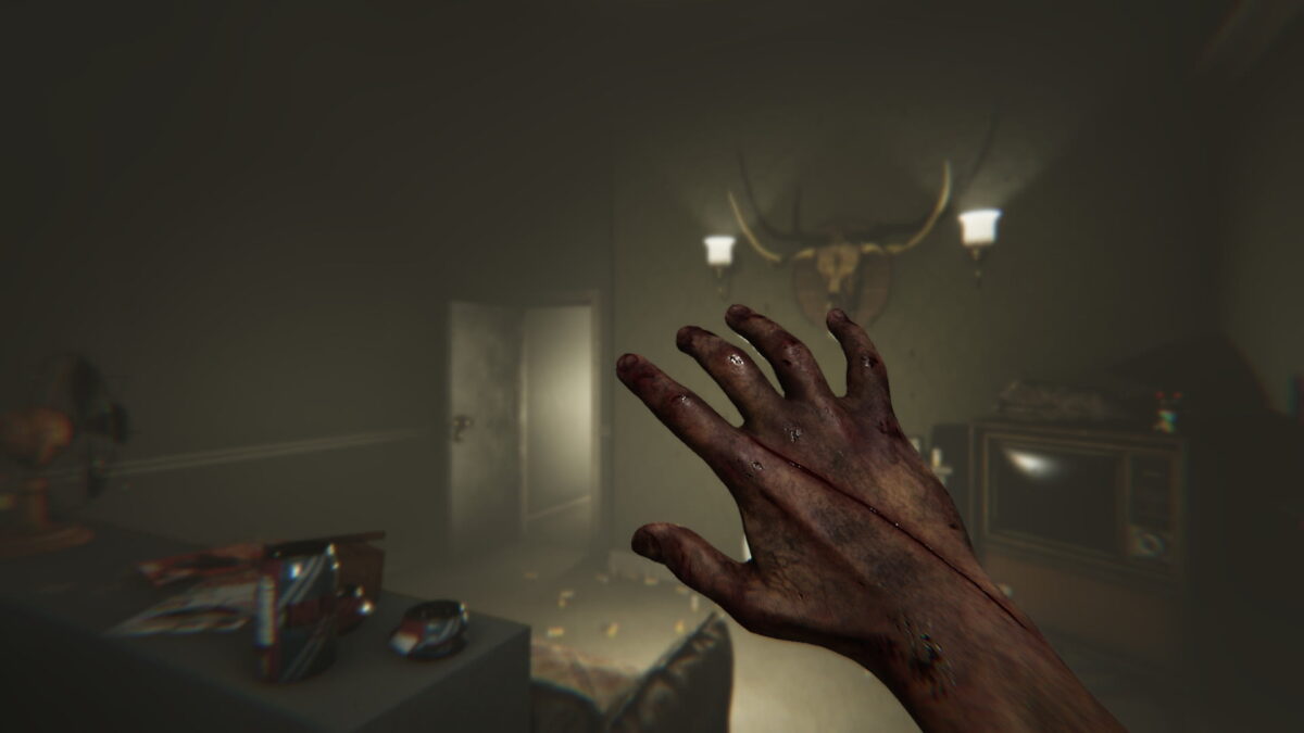 First person perspective of a person raising a hand in front of their face in a creepy kitchen in "MADiSON"