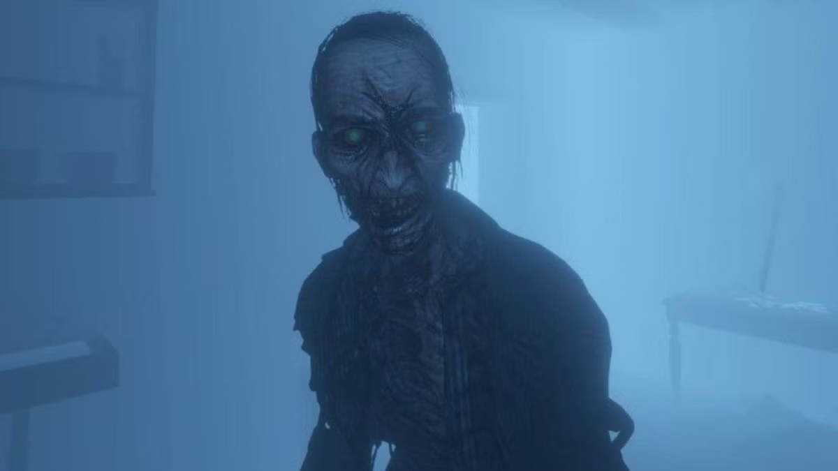 A decaying ghosts leers at the camera in "Phasmophobia"