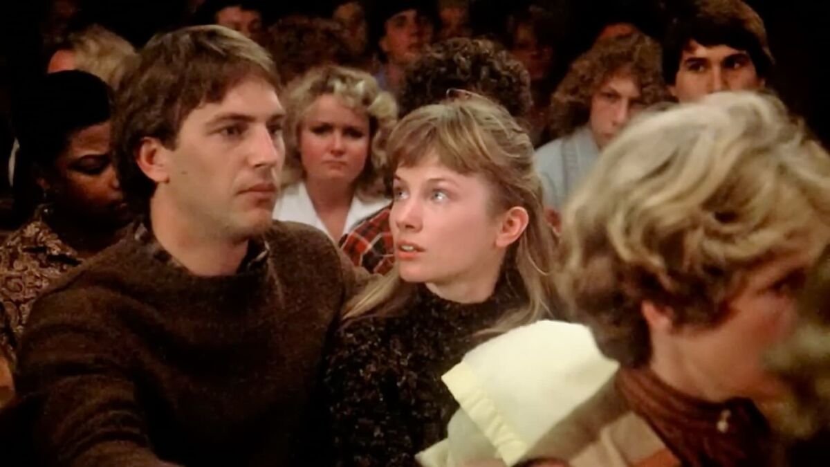 A young woman looks at a young man in concern in "Testament"