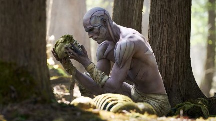 creature bent over with a head