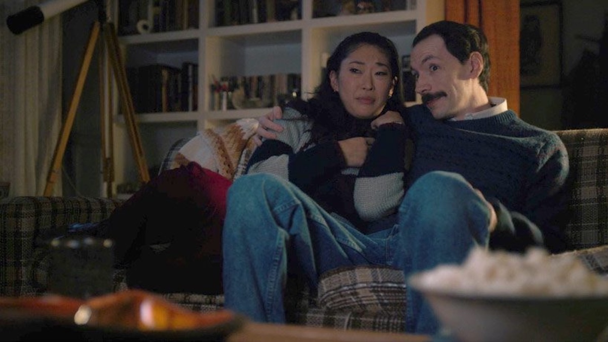 Mr. Clarke sitting on a couch