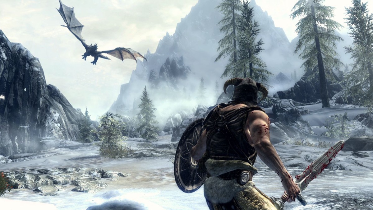 A warrior faces off against an approaching dragon in "Elder Scrolls V: Skyrim" 