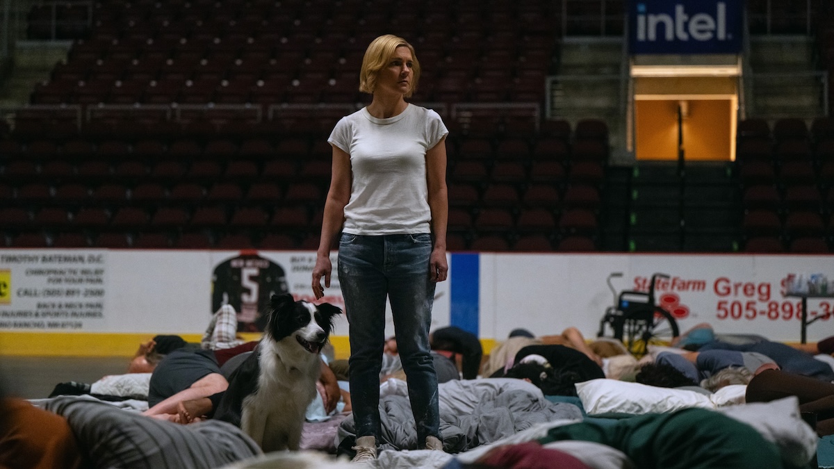 carol standing in a room of people