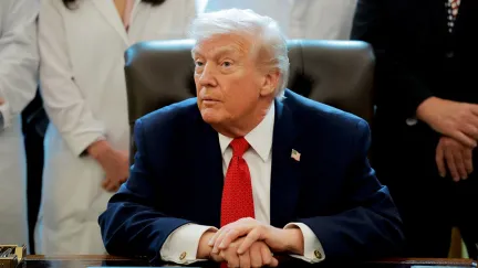 WASHINGTON, DC - DECEMBER 18: U.S. President Donald Trump speaks to journalists after signing an executive order in the Oval Office of the White House on December 18, 2025 in Washington, DC. Trump signed the order reclassifying marijuana as a schedule III drug. (Photo by Anna Moneymaker/Getty Images)