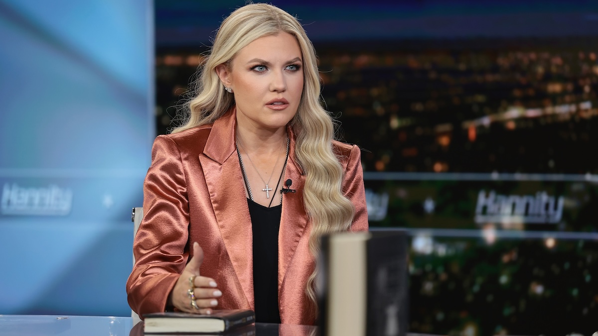 Erika Kirk sitting at a table